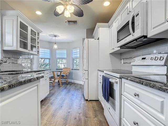1670 Palo Duro Blvd, North Fort Myers, FL 33917 - kitchen with white appliances, white cabinetry, ceiling fan, tasteful backsplash, and recessed lighting