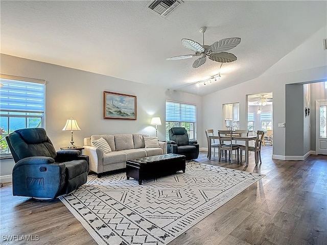1670 Palo Duro Blvd, North Fort Myers, FL 33917 - living room featuring ceiling fan, a textured ceiling, wood finished floors, and vaulted ceiling