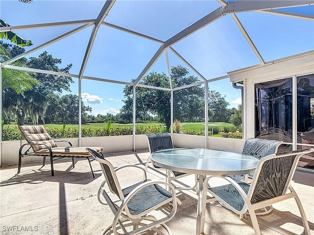 1670 Palo Duro Blvd, North Fort Myers, FL 33917 - view of patio with glass enclosure and outdoor dining area