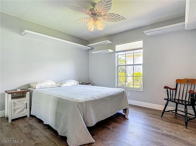 1670 Palo Duro Blvd, North Fort Myers, FL 33917 - bedroom featuring dark wood-style flooring and a ceiling fan