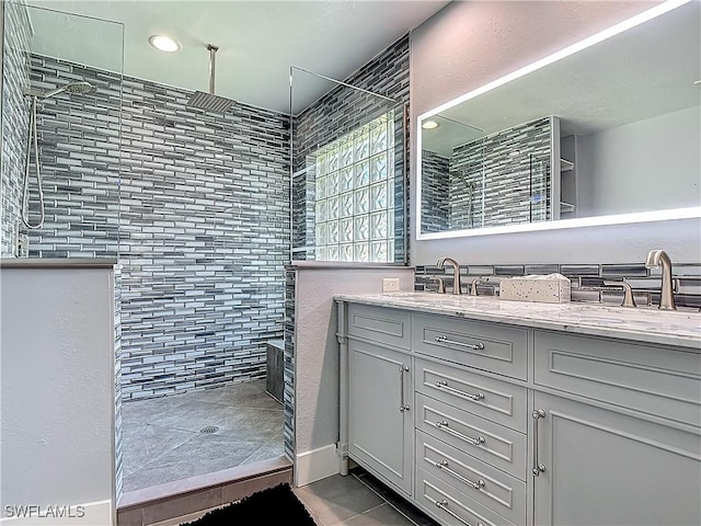 1670 Palo Duro Blvd, North Fort Myers, FL 33917 - bathroom with walk in shower, double vanity, and tile patterned floors