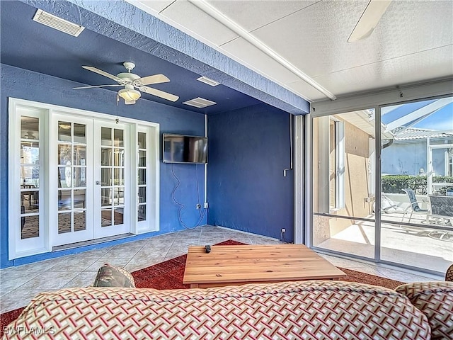 1670 Palo Duro Blvd, North Fort Myers, FL 33917 - entrance to property featuring a ceiling fan, french doors, a patio, and stucco siding