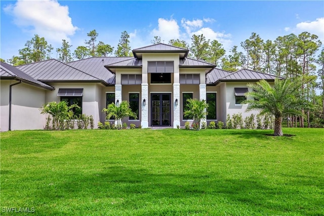 5174 Sycamore Dr, Naples, FL 34119 - back of property with a standing seam roof, a metal roof, and french doors