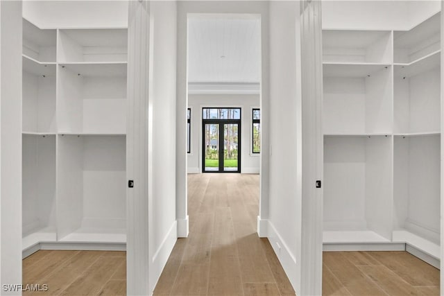 5174 Sycamore Dr, Naples, FL 34119 - walk in closet with wood finished floors