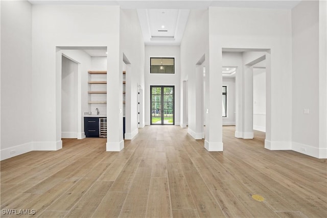 5174 Sycamore Dr, Naples, FL 34119 - foyer featuring light wood-type flooring and bar area