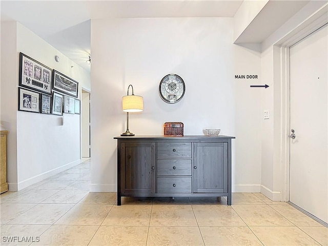 3000 Oasis Grand Blvd Unit 1203, Fort Myers, FL 33916 - corridor featuring light tile patterned floors