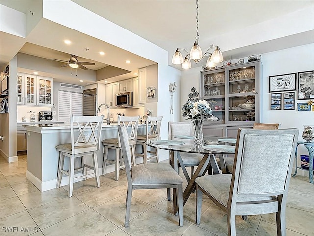 3000 Oasis Grand Blvd Unit 1203, Fort Myers, FL 33916 - dining space with a ceiling fan, recessed lighting, a chandelier, and light tile patterned flooring