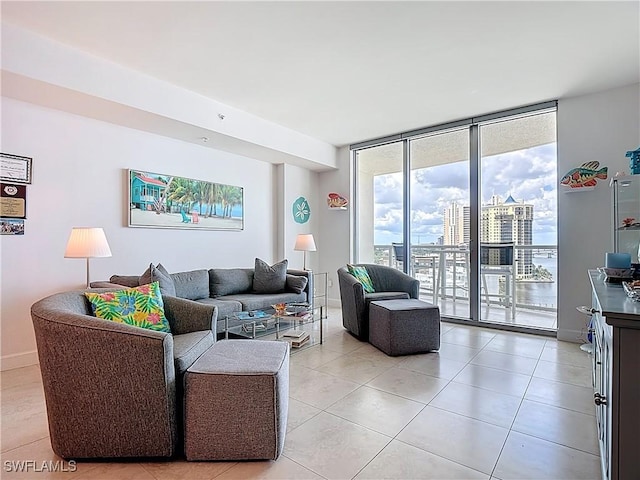 3000 Oasis Grand Blvd Unit 1203, Fort Myers, FL 33916 - living room with floor to ceiling windows, light tile patterned floors, and a city view