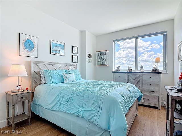 3000 Oasis Grand Blvd Unit 1203, Fort Myers, FL 33916 - bedroom featuring light wood-style flooring