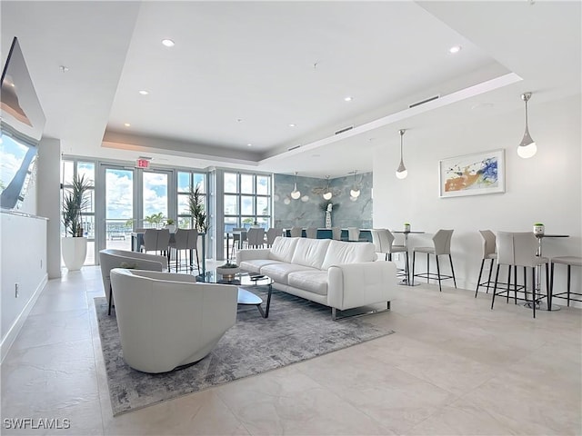 3000 Oasis Grand Blvd Unit 1203, Fort Myers, FL 33916 - living room with a tray ceiling, plenty of natural light, and recessed lighting