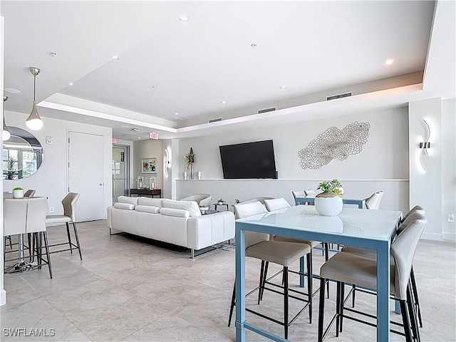3000 Oasis Grand Blvd Unit 1203, Fort Myers, FL 33916 - living room featuring a tray ceiling, recessed lighting, and light marble finish floors