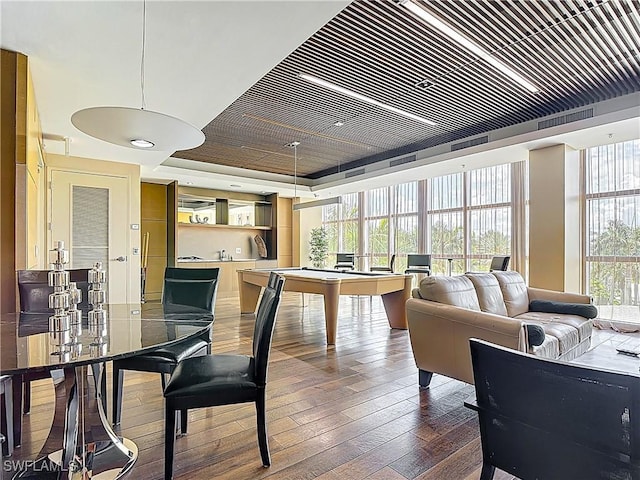 3000 Oasis Grand Blvd Unit 1203, Fort Myers, FL 33916 - dining space featuring hardwood / wood-style flooring, a raised ceiling, and billiards