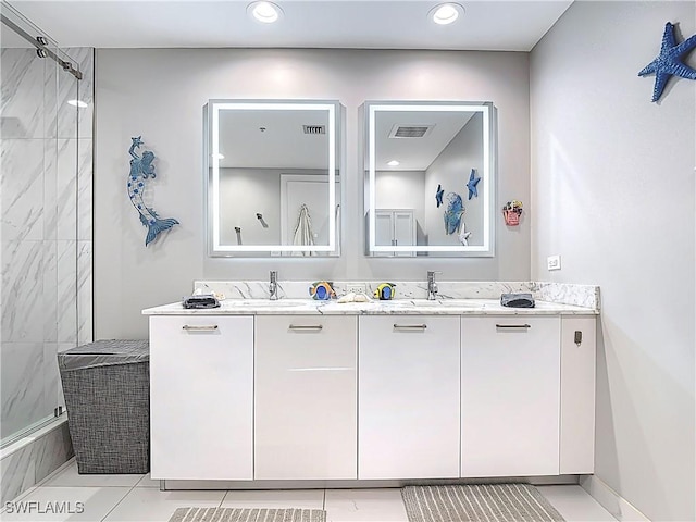 3000 Oasis Grand Blvd Unit 1203, Fort Myers, FL 33916 - full bathroom with double vanity, tiled shower, recessed lighting, and tile patterned floors