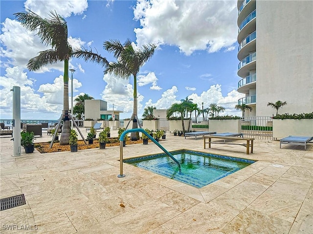 3000 Oasis Grand Blvd Unit 1203, Fort Myers, FL 33916 - view of swimming pool featuring a community hot tub