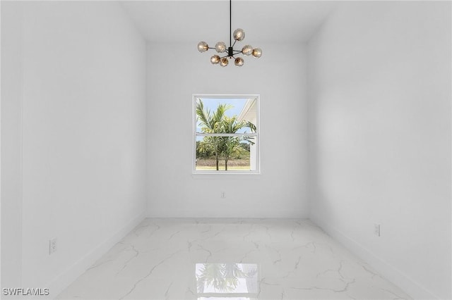 3805 E 16th St, Lehigh Acres, FL 33972 - empty room with a chandelier and marble look tiles
