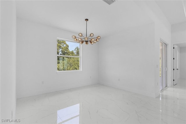 3805 E 16th St, Lehigh Acres, FL 33972 - unfurnished room featuring marble tiled flooring and a chandelier