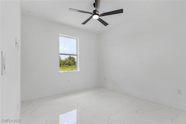 3805 E 16th St, Lehigh Acres, FL 33972 - spare room with marble finish floors and ceiling fan