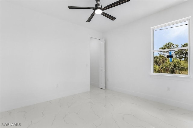 3805 E 16th St, Lehigh Acres, FL 33972 - unfurnished room featuring a ceiling fan and marble finish floors