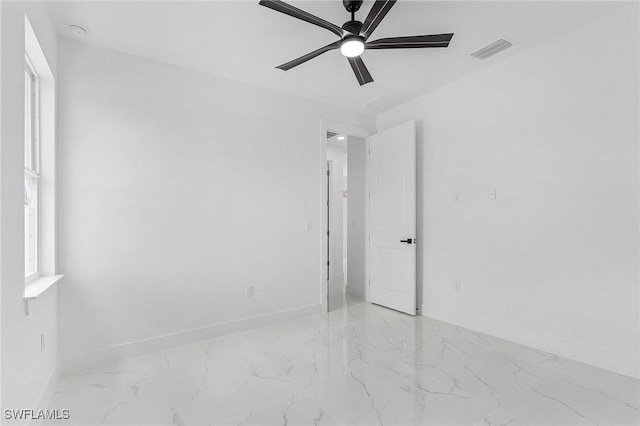 3805 E 16th St, Lehigh Acres, FL 33972 - spare room with marble tiled flooring, ceiling fan, and a smoke detector