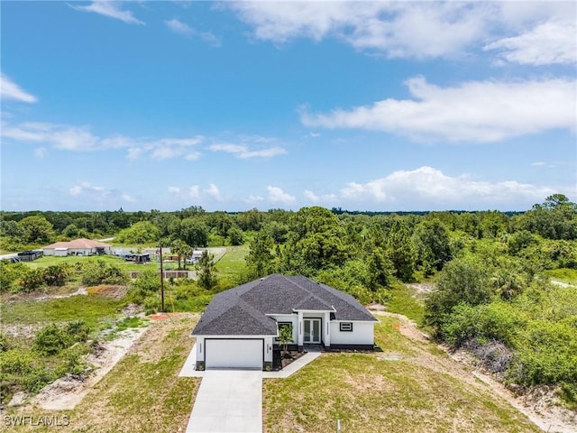 3805 E 16th St, Lehigh Acres, FL 33972 - view of subject property with a heavily wooded area