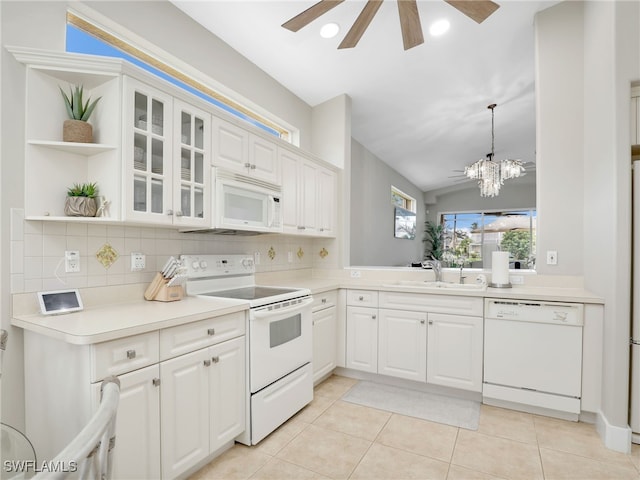 8612 Ibis Cove Cir, Naples, FL 34119 - kitchen with white appliances, open shelves, tasteful backsplash, ceiling fan, and vaulted ceiling