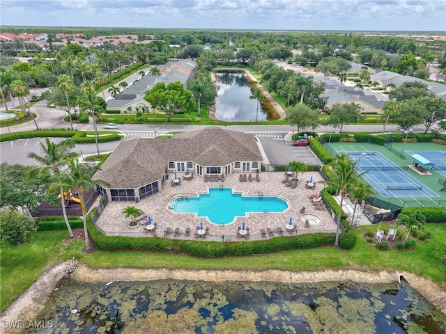 8612 Ibis Cove Cir, Naples, FL 34119 - aerial perspective of suburban area featuring a pool and a large body of water