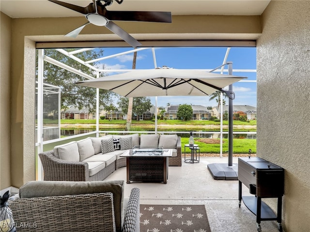 8612 Ibis Cove Cir, Naples, FL 34119 - view of patio with ceiling fan, a water view, an outdoor living space, glass enclosure, and a residential view