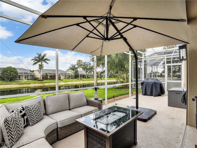8612 Ibis Cove Cir, Naples, FL 34119 - view of patio / terrace with an outdoor living space with a fire pit, a water view, area for grilling, and glass enclosure