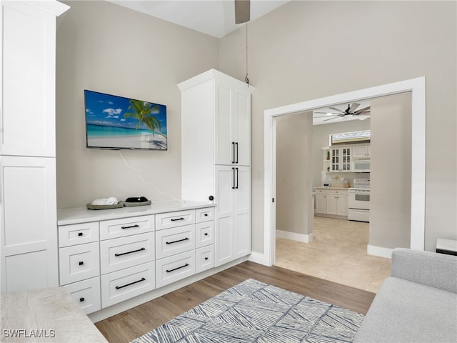 8612 Ibis Cove Cir, Naples, FL 34119 - living room with ceiling fan and light wood-type flooring