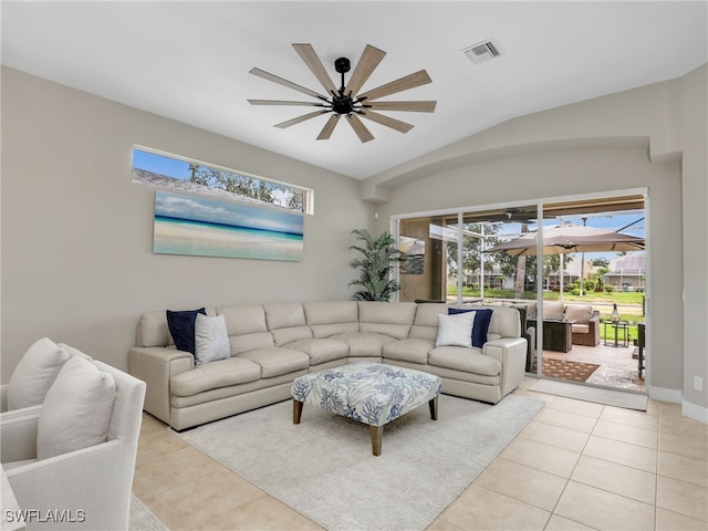 8612 Ibis Cove Cir, Naples, FL 34119 - living room featuring healthy amount of natural light, light tile patterned floors, ceiling fan, and lofted ceiling