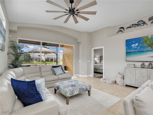 8612 Ibis Cove Cir, Naples, FL 34119 - tiled living room with a ceiling fan