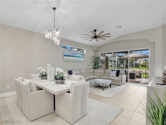 8612 Ibis Cove Cir, Naples, FL 34119 - dining space with ceiling fan, a chandelier, light tile patterned flooring, and vaulted ceiling