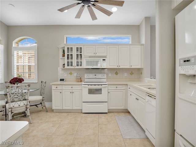 8612 Ibis Cove Cir, Naples, FL 34119 - kitchen with white appliances, tasteful backsplash, a ceiling fan, and light countertops