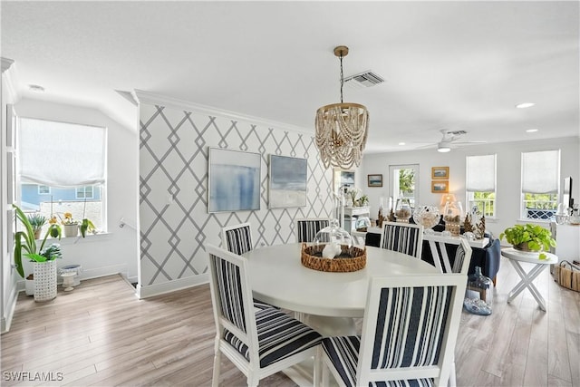 719 Park Ave, Naples, FL 34110 - dining room with a chandelier, light wood finished floors, recessed lighting, and a ceiling fan
