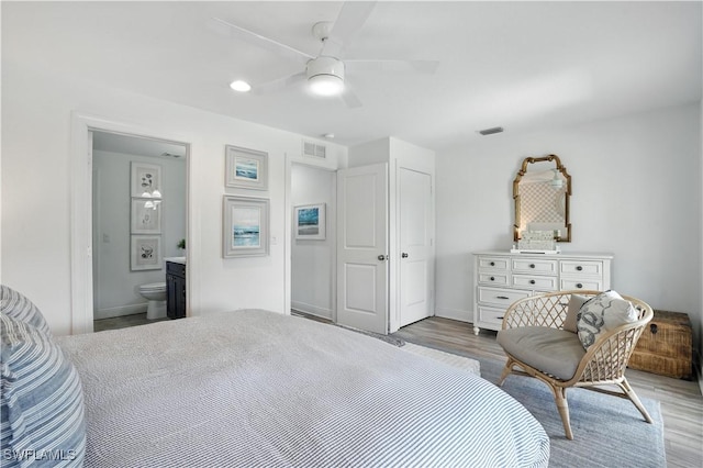 719 Park Ave, Naples, FL 34110 - bedroom featuring wood finished floors, ceiling fan, ensuite bathroom, and recessed lighting