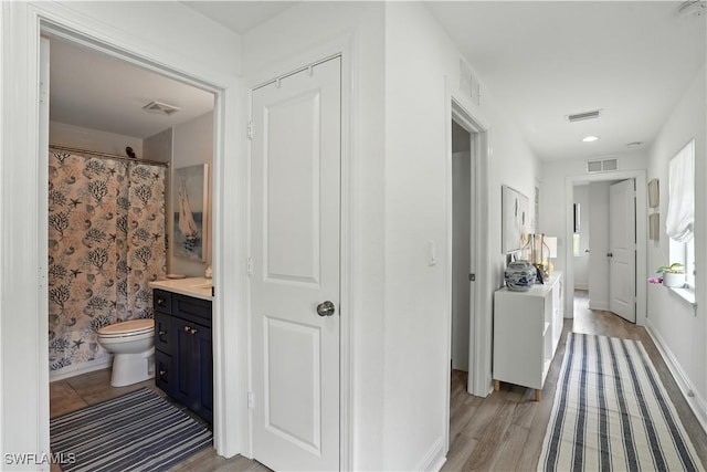 719 Park Ave, Naples, FL 34110 - hall with light wood finished floors and baseboards
