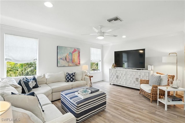 719 Park Ave, Naples, FL 34110 - living area with ornamental molding, light wood finished floors, a ceiling fan, and recessed lighting