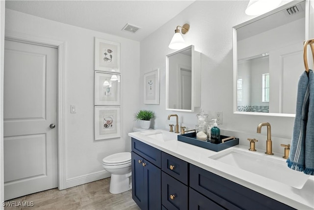 719 Park Ave, Naples, FL 34110 - full bath featuring double vanity and wood finished floors