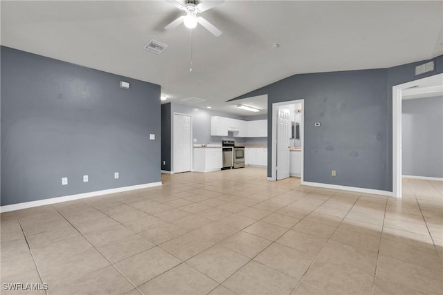 4508/4510 30th St SW, Lehigh Acres, FL 33973 - unfurnished living room with vaulted ceiling, a ceiling fan, and light tile patterned floors