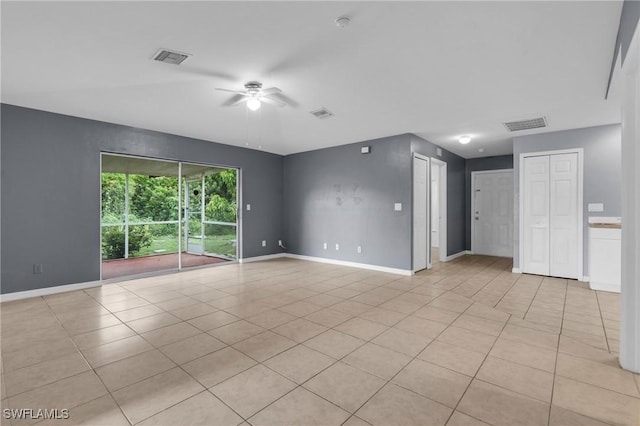 4508/4510 30th St SW, Lehigh Acres, FL 33973 - empty room with ceiling fan and light tile patterned floors