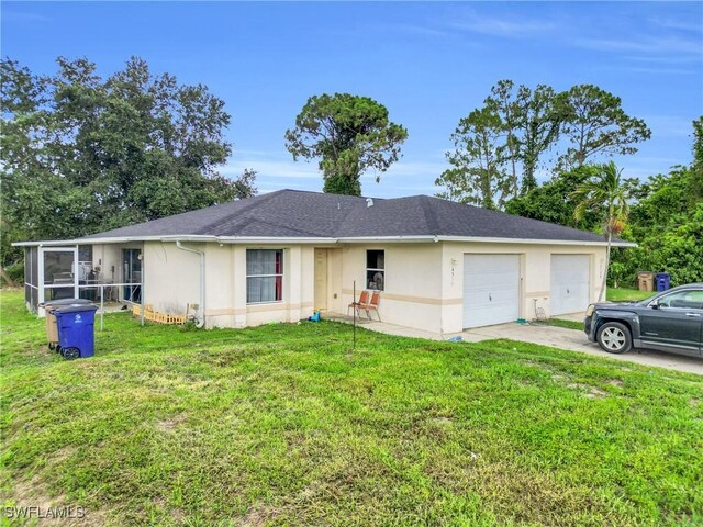 4508/4510 30th St SW, Lehigh Acres, FL 33973 - single story home with an attached garage, concrete driveway, a front lawn, and stucco siding