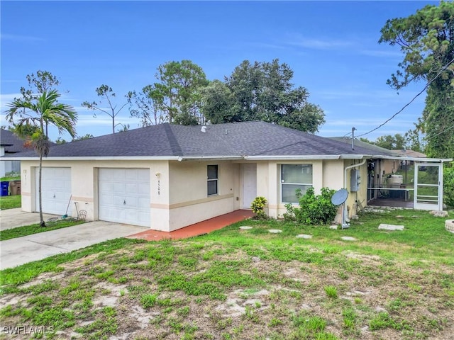 4508/4510 30th St SW, Lehigh Acres, FL 33973 - view of front facade with stucco siding, a garage, driveway, and a sunroom