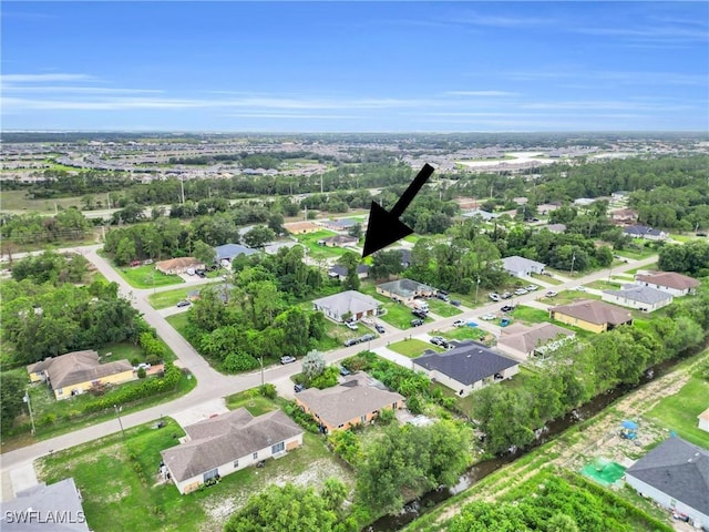 4508/4510 30th St SW, Lehigh Acres, FL 33973 - aerial view of property and surrounding area with nearby suburban area