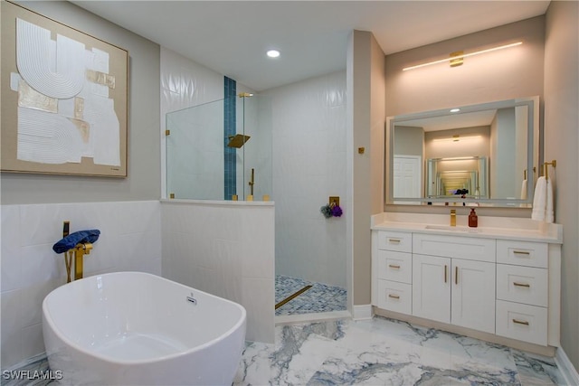 28601 Firenze Way Unit 102, Bonita Springs, FL 34135 - full bathroom with a soaking tub, a walk in shower, marble look tiles, vanity, and recessed lighting