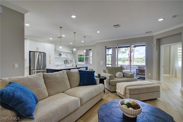 28601 Firenze Way Unit 102, Bonita Springs, FL 34135 - living area featuring recessed lighting, ornamental molding, and light wood-style flooring