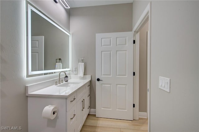 28601 Firenze Way Unit 102, Bonita Springs, FL 34135 - bathroom with vanity and wood finished floors