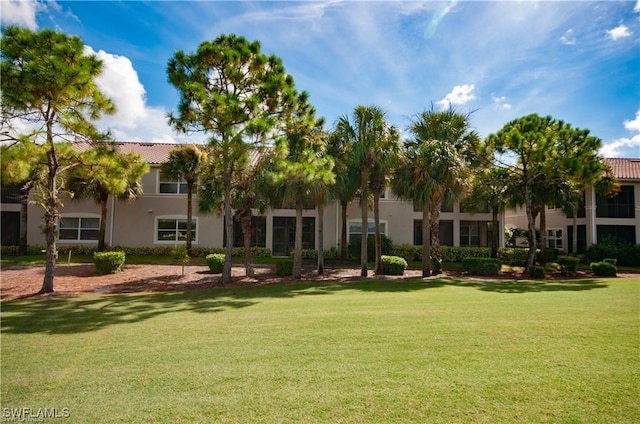 28601 Firenze Way Unit 102, Bonita Springs, FL 34135 - surrounding community with a yard