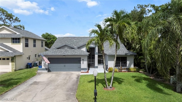17971 Bermuda Dunes Dr, Fort Myers, FL 33967 - view of front facade with an attached garage, a shingled roof, concrete driveway, and a front yard