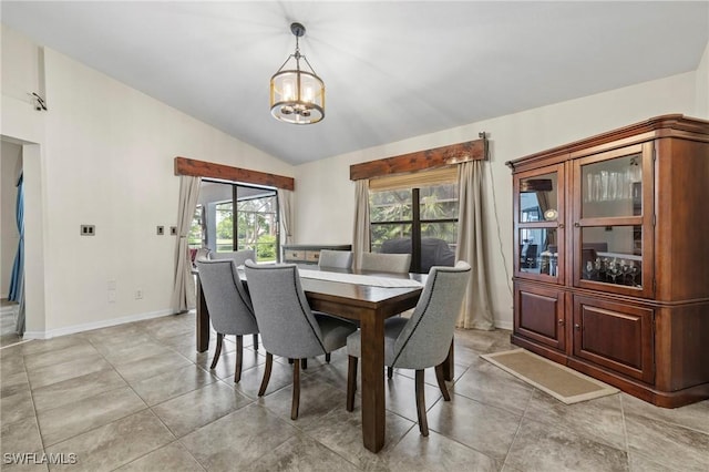 17971 Bermuda Dunes Dr, Fort Myers, FL 33967 - dining room with a chandelier, vaulted ceiling, and light tile patterned floors