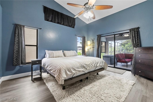 17971 Bermuda Dunes Dr, Fort Myers, FL 33967 - bedroom with high vaulted ceiling, access to outside, wood finished floors, and ceiling fan
